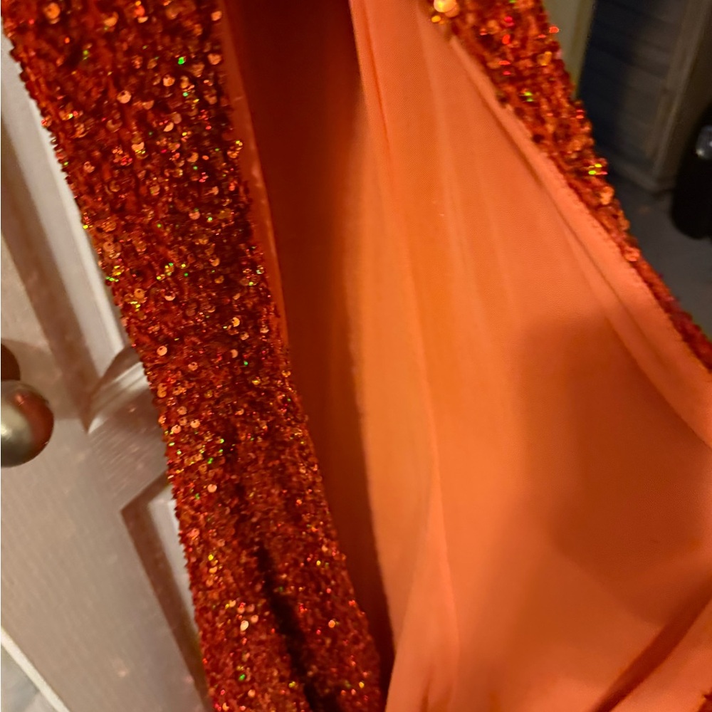 Orange sequin dress.